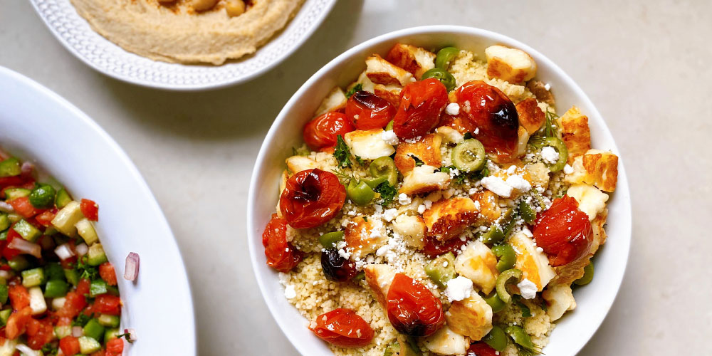 Grilled Halloumi Couscous with Blistered Tomatoes, Olives, & Feta